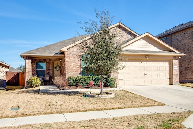 single story home featuring concrete driveway, brick siding, an attached garage, and cooling unit