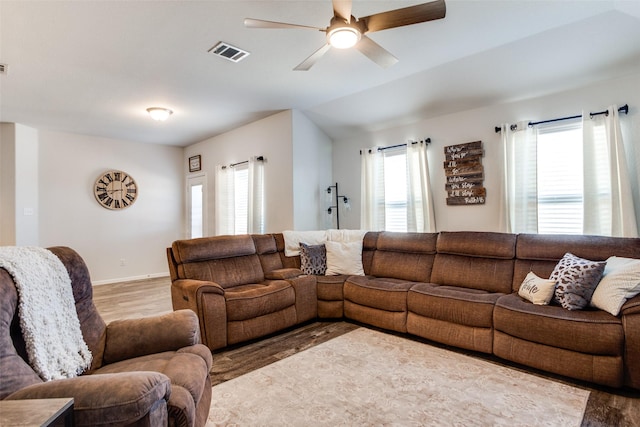 living room with ceiling fan and wood-type flooring