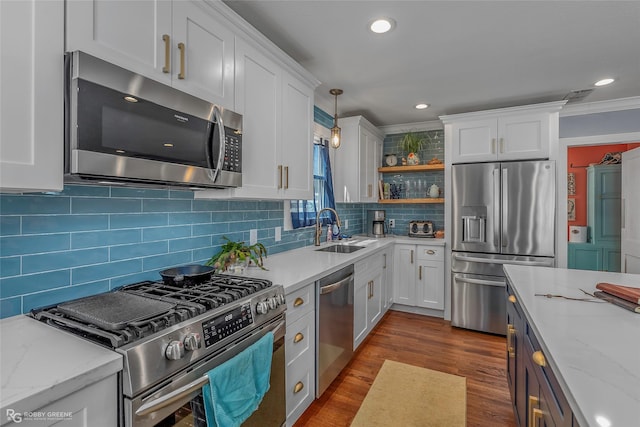 kitchen featuring a sink, dark wood finished floors, white cabinets, stainless steel appliances, and open shelves