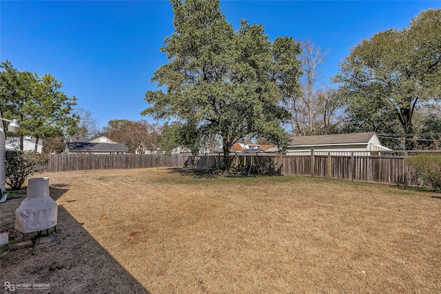 view of yard with a fenced backyard