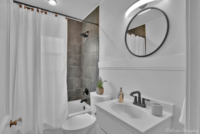 bathroom with vanity, shower / bath combination with curtain, and toilet