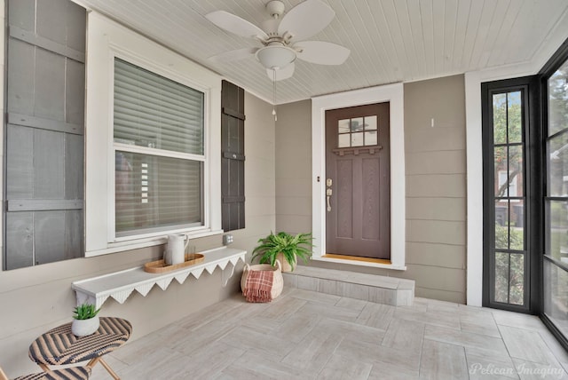 property entrance with a porch and ceiling fan