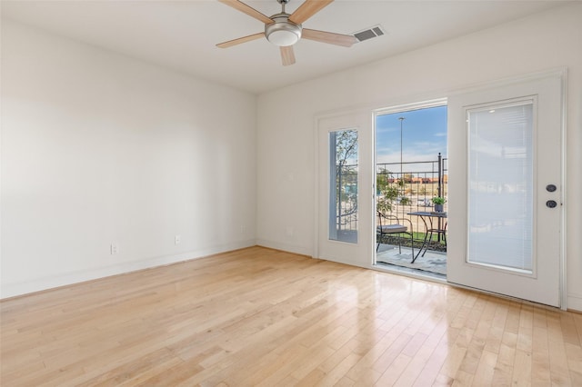 unfurnished room with light hardwood / wood-style floors and ceiling fan