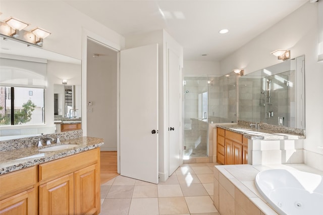 bathroom featuring tile patterned floors, vanity, and independent shower and bath