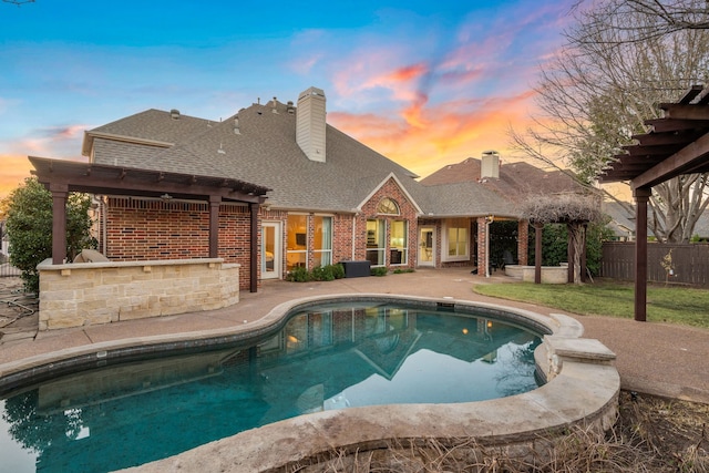 pool at dusk featuring a fenced in pool, a patio area, and fence