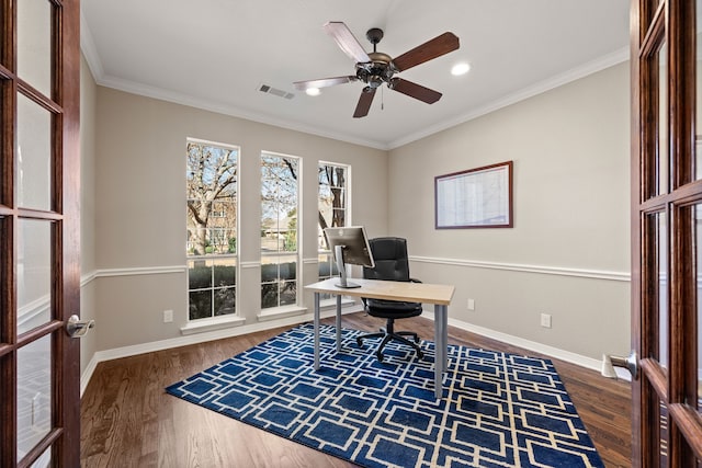 office space featuring ornamental molding, visible vents, baseboards, and wood finished floors