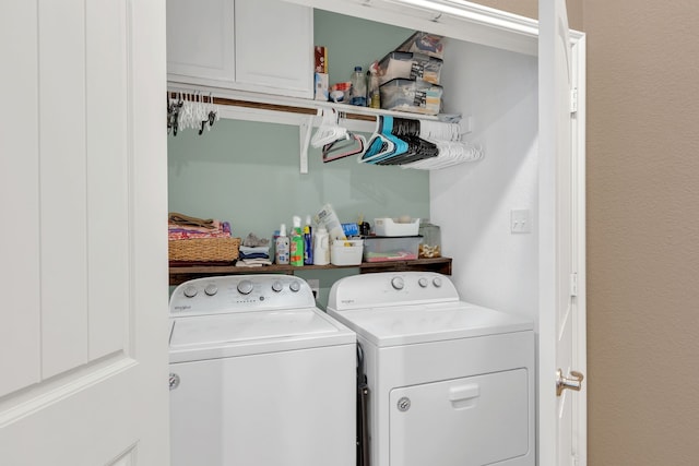 clothes washing area featuring washer and dryer