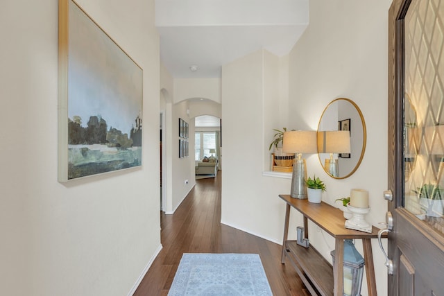 hallway with dark hardwood / wood-style floors