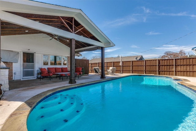 view of swimming pool with a fenced in pool, a patio, outdoor lounge area, a ceiling fan, and a fenced backyard