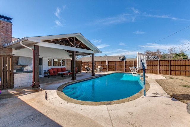 view of pool with area for grilling, a patio area, a fenced backyard, and a fenced in pool