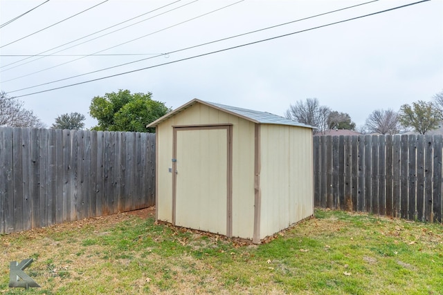 view of outbuilding featuring a yard