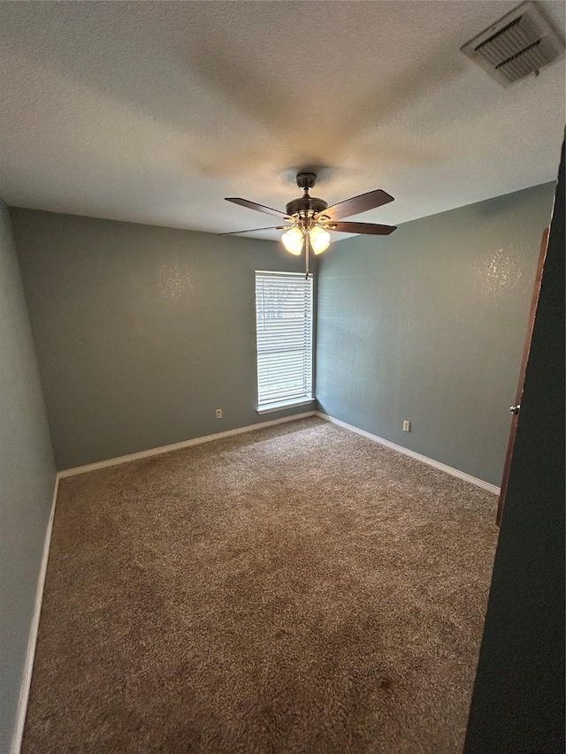 unfurnished room featuring carpet, a textured ceiling, and ceiling fan