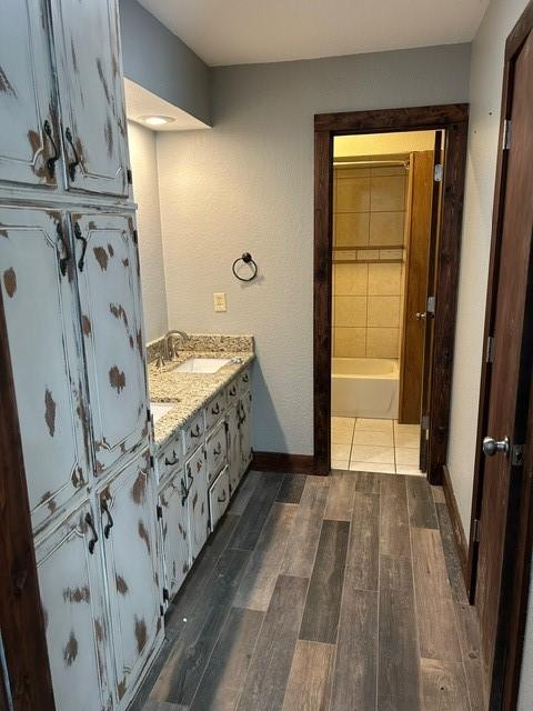 bathroom featuring wood-type flooring and vanity