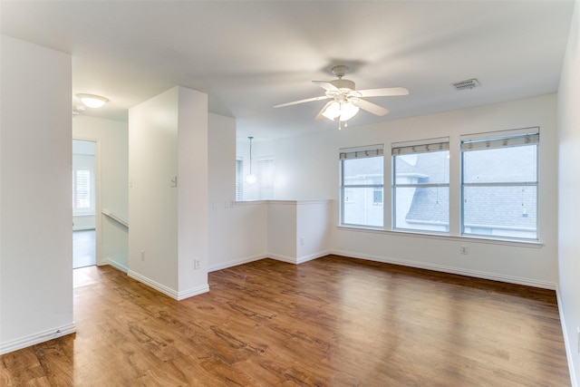 unfurnished room featuring ceiling fan and wood-type flooring