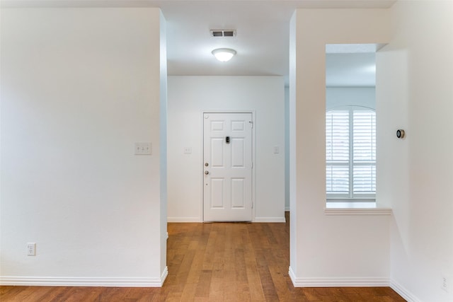 hallway with light wood-type flooring