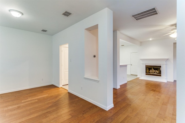 interior space featuring light wood-type flooring and ceiling fan