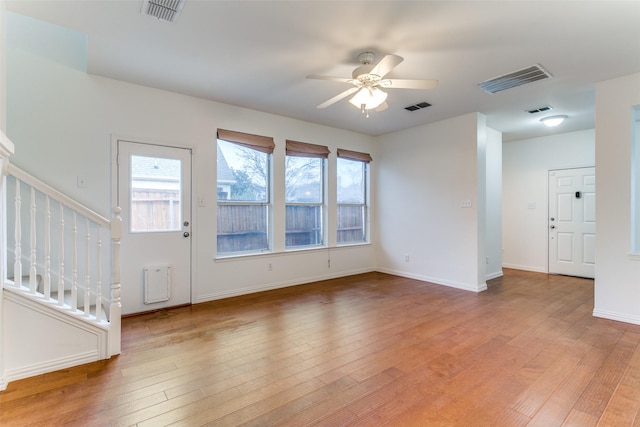 interior space with ceiling fan and light hardwood / wood-style floors