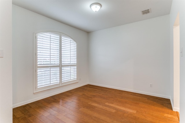 spare room with light hardwood / wood-style flooring