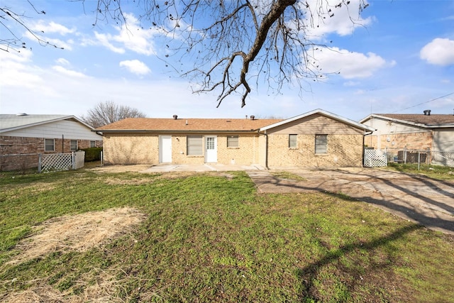 back of property featuring a yard and a patio area