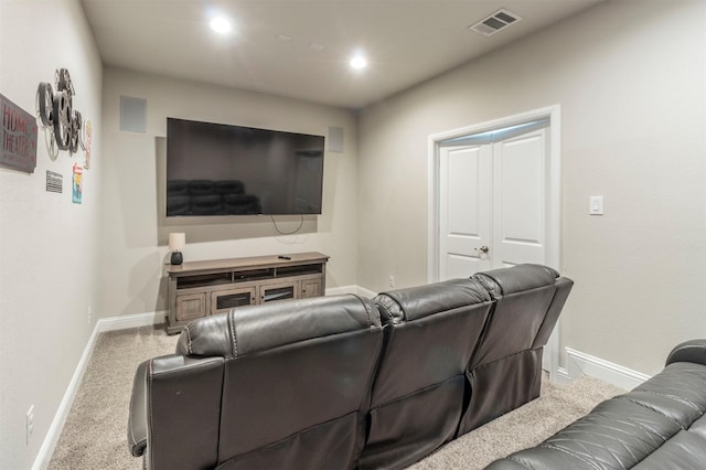 carpeted cinema room with recessed lighting, visible vents, and baseboards