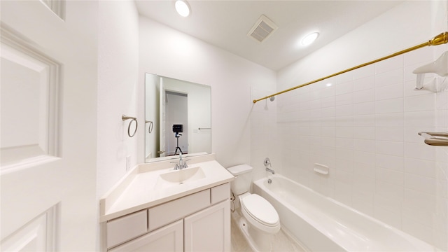 full bathroom featuring toilet, vanity, and tiled shower / bath