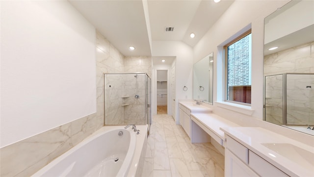 bathroom with separate shower and tub and vanity