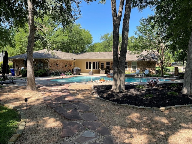 view of swimming pool featuring a patio