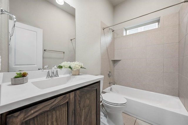 bathroom featuring tile patterned floors, vanity, toilet, and shower / tub combination