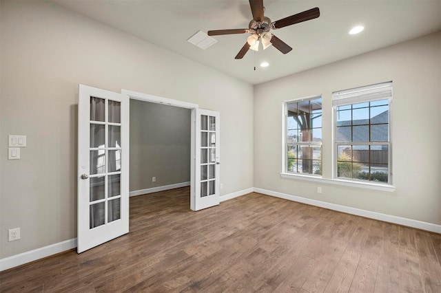 empty room featuring a ceiling fan, wood finished floors, recessed lighting, french doors, and baseboards