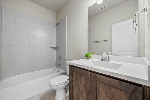 bathroom with visible vents, washtub / shower combination, toilet, tile patterned floors, and vanity