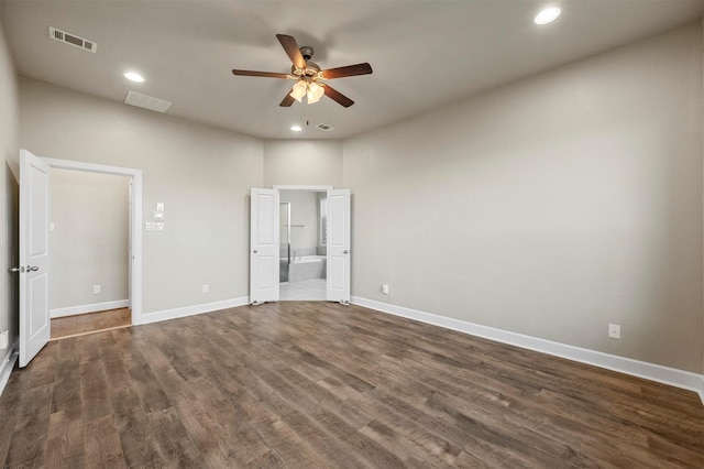 unfurnished bedroom featuring visible vents, recessed lighting, baseboards, and dark wood-style flooring