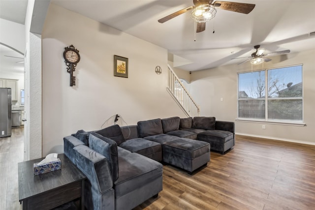 living room with ceiling fan, hardwood / wood-style floors, and a wealth of natural light