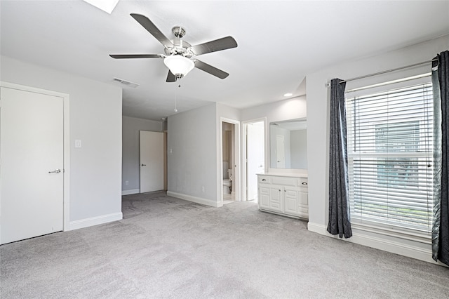 2529 Guerrero Dr, Carrollton, TX 75006 - unfurnished bedroom with light carpet, multiple windows, visible vents, and baseboards