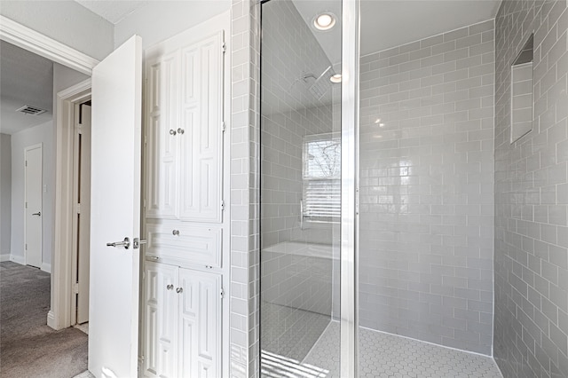 2529 Guerrero Dr, Carrollton, TX 75006 - bathroom featuring recessed lighting, visible vents, baseboards, and a walk in shower