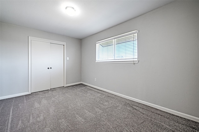 2529 Guerrero Dr, Carrollton, TX 75006 - unfurnished bedroom featuring a closet, carpet flooring, and baseboards