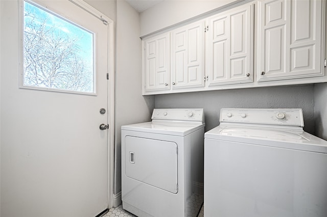 2529 Guerrero Dr, Carrollton, TX 75006 - laundry room with cabinet space and independent washer and dryer