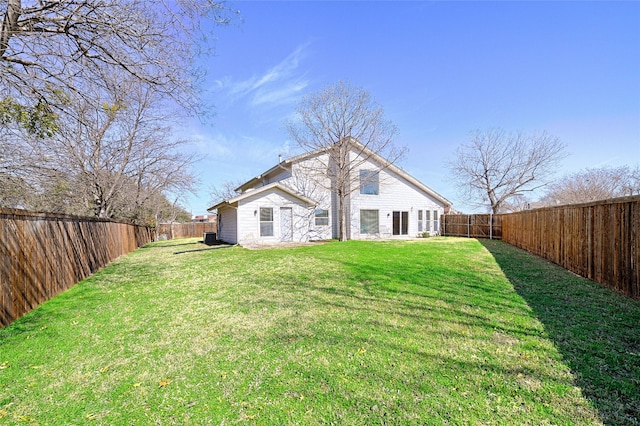 2529 Guerrero Dr, Carrollton, TX 75006 - back of property with a yard and a fenced backyard