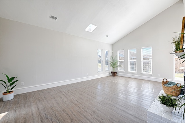 2529 Guerrero Dr, Carrollton, TX 75006 - living room with baseboards, wood finished floors, and high vaulted ceiling