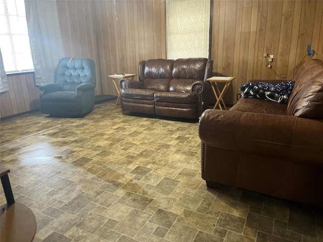 living room featuring wood walls