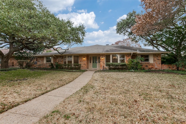 ranch-style home with a front yard