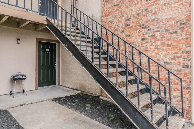 property entrance with brick siding