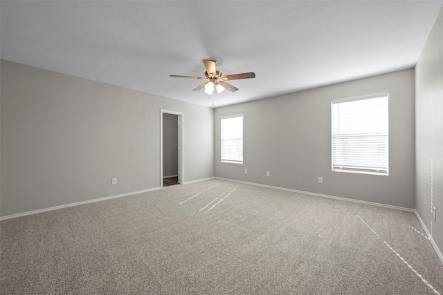 carpeted empty room with ceiling fan