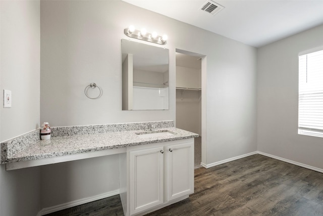 bathroom with hardwood / wood-style flooring and vanity