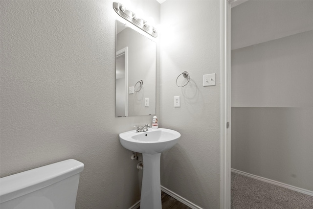 bathroom featuring sink and toilet