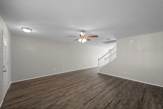 unfurnished living room with ceiling fan and dark hardwood / wood-style flooring