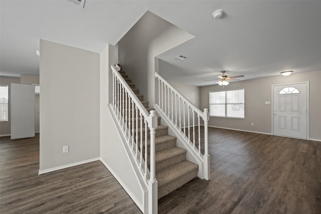 entryway with ceiling fan and dark wood-type flooring