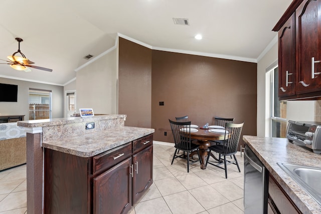 kitchen with vaulted ceiling, dishwasher, ceiling fan, light tile patterned floors, and crown molding