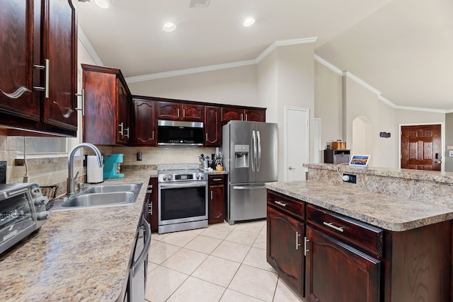 kitchen with stainless steel appliances, sink, ornamental molding, vaulted ceiling, and light tile patterned flooring