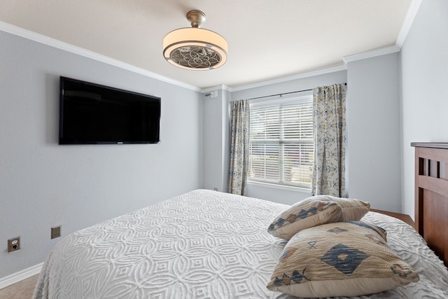 bedroom with ornamental molding