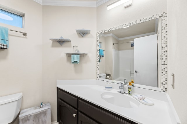 full bathroom with shower / bathing tub combination, vanity, crown molding, and toilet